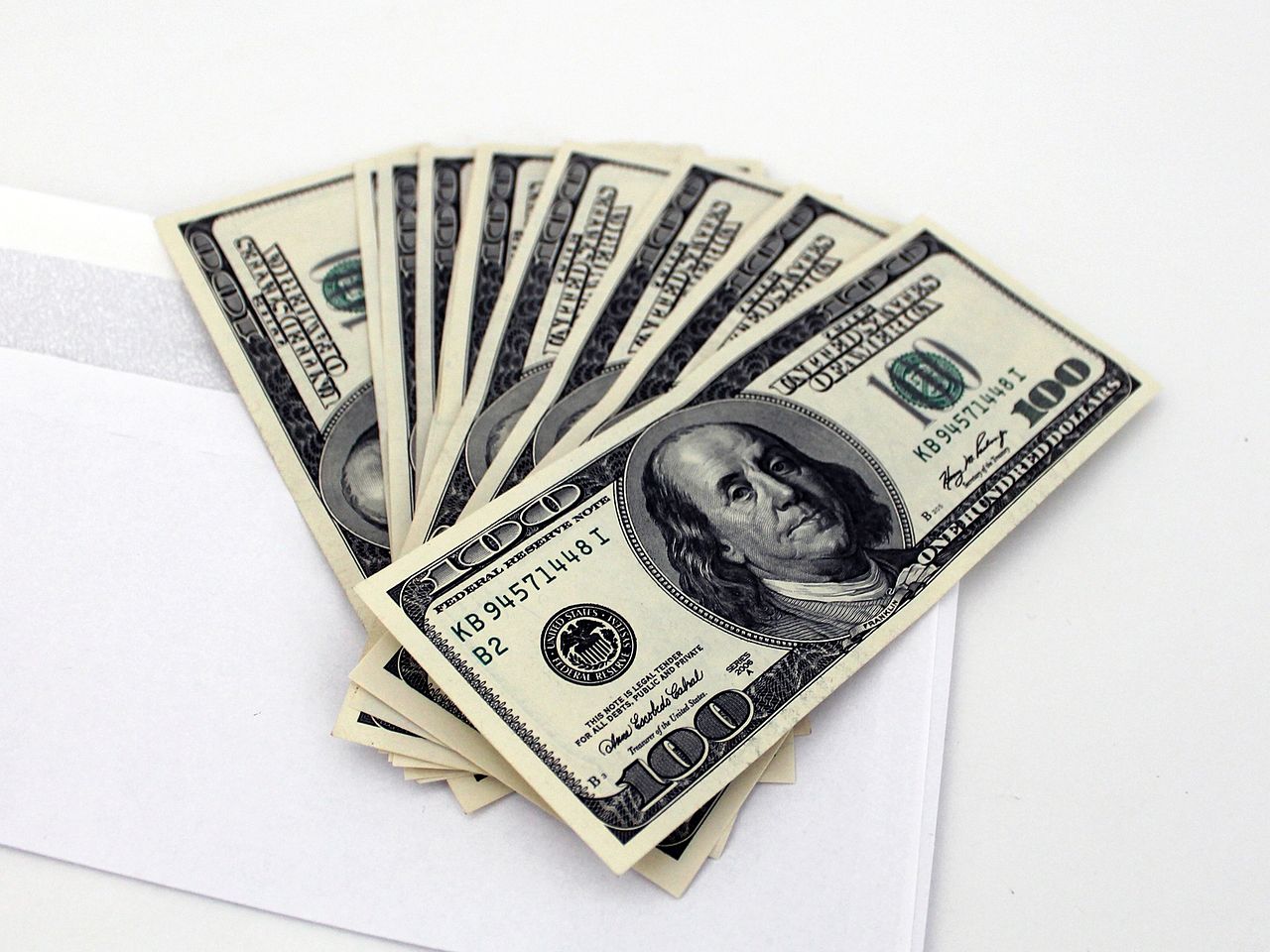 1280px-US_Dollars_and_envelope